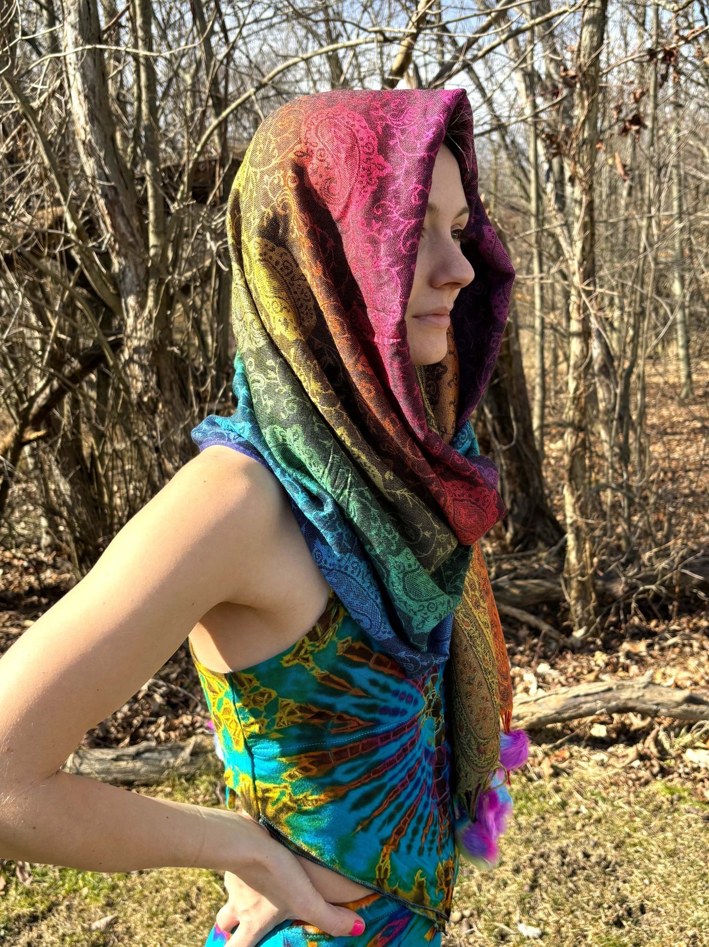 Rainbow Pom-Pom Pashmina outdoors in a wooded area