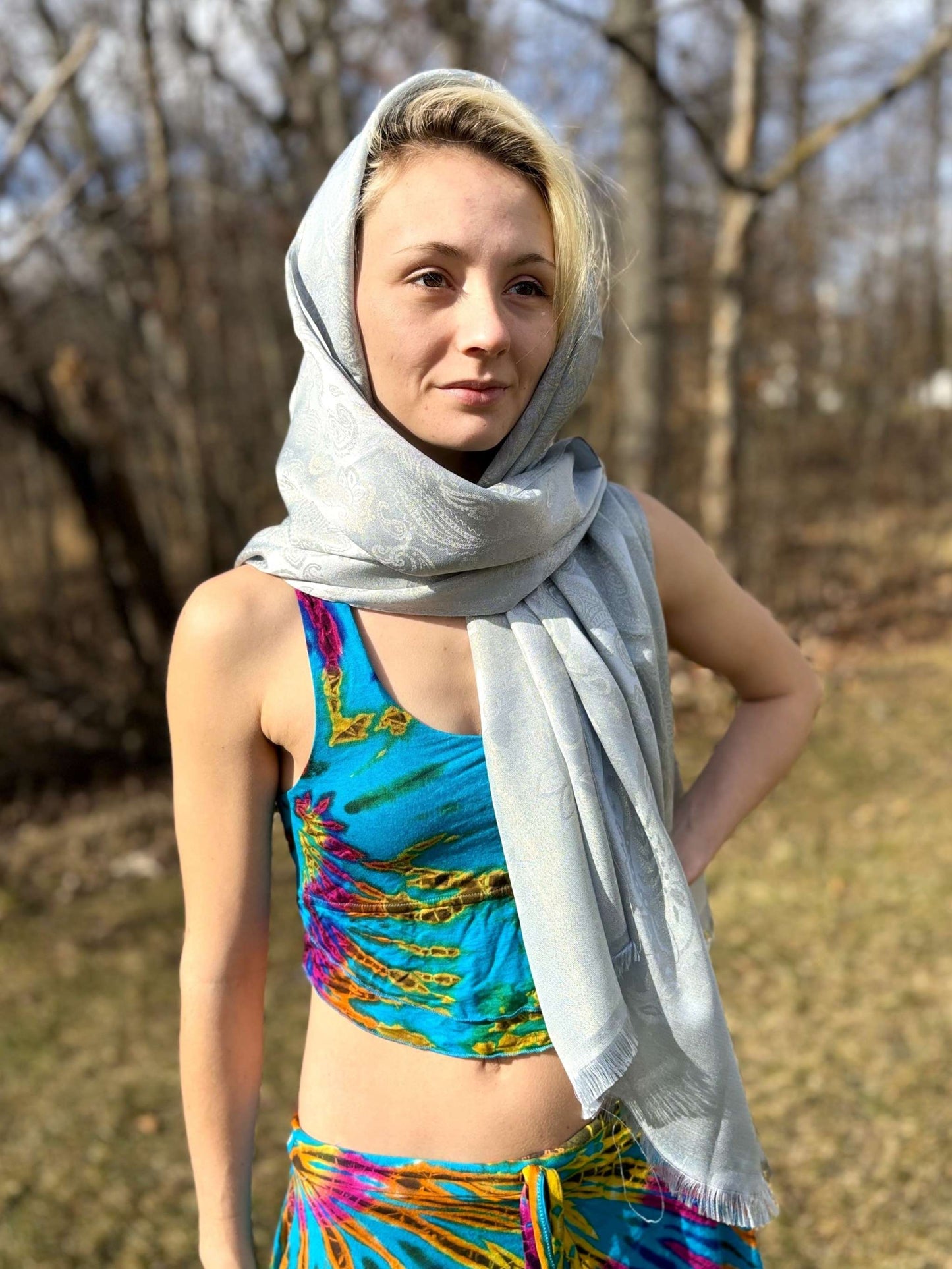 Woman wearing Delicate Lace Pashmina in a natural setting.