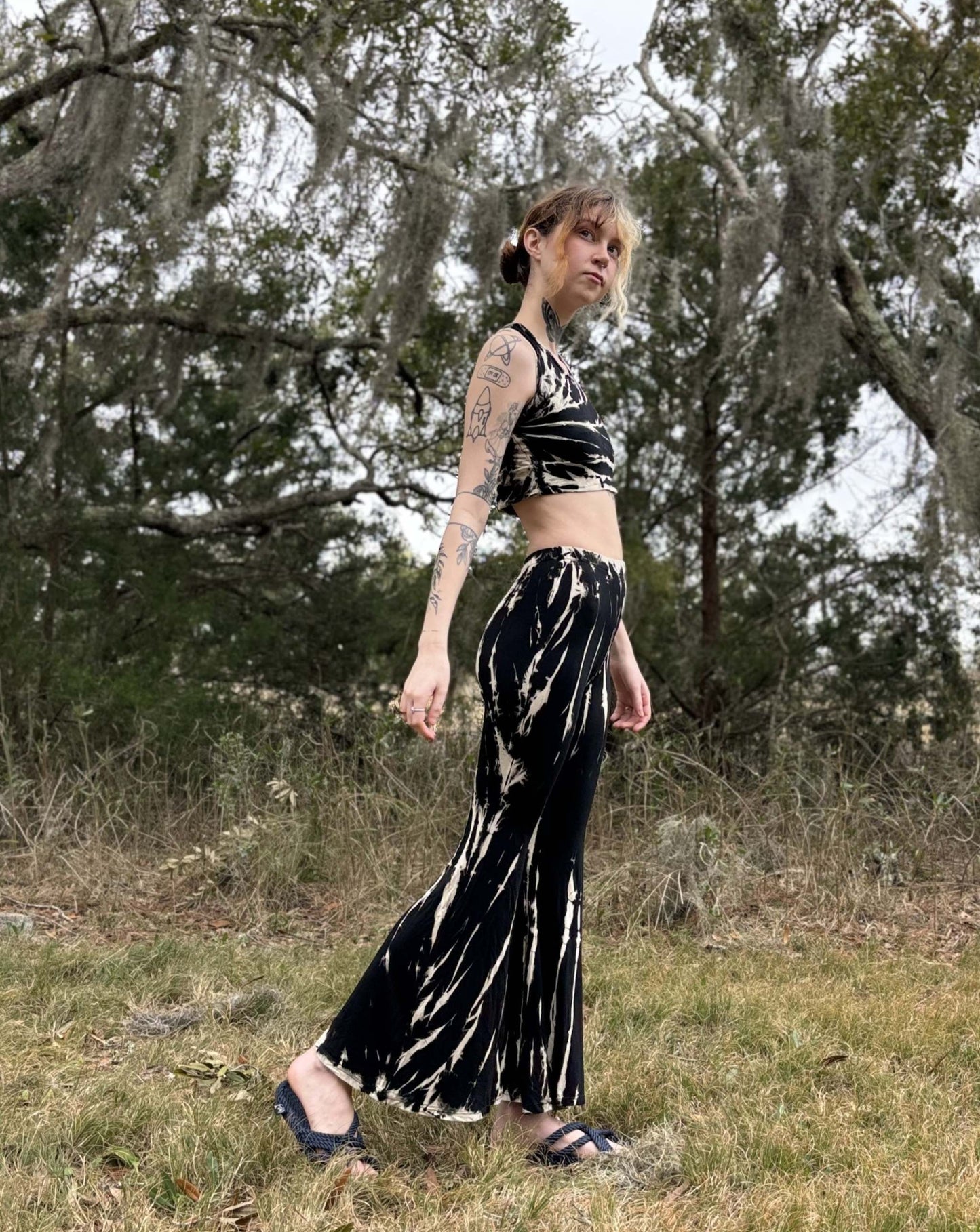 Tie-Dye Bell Bottoms modeled outdoors with nature background.