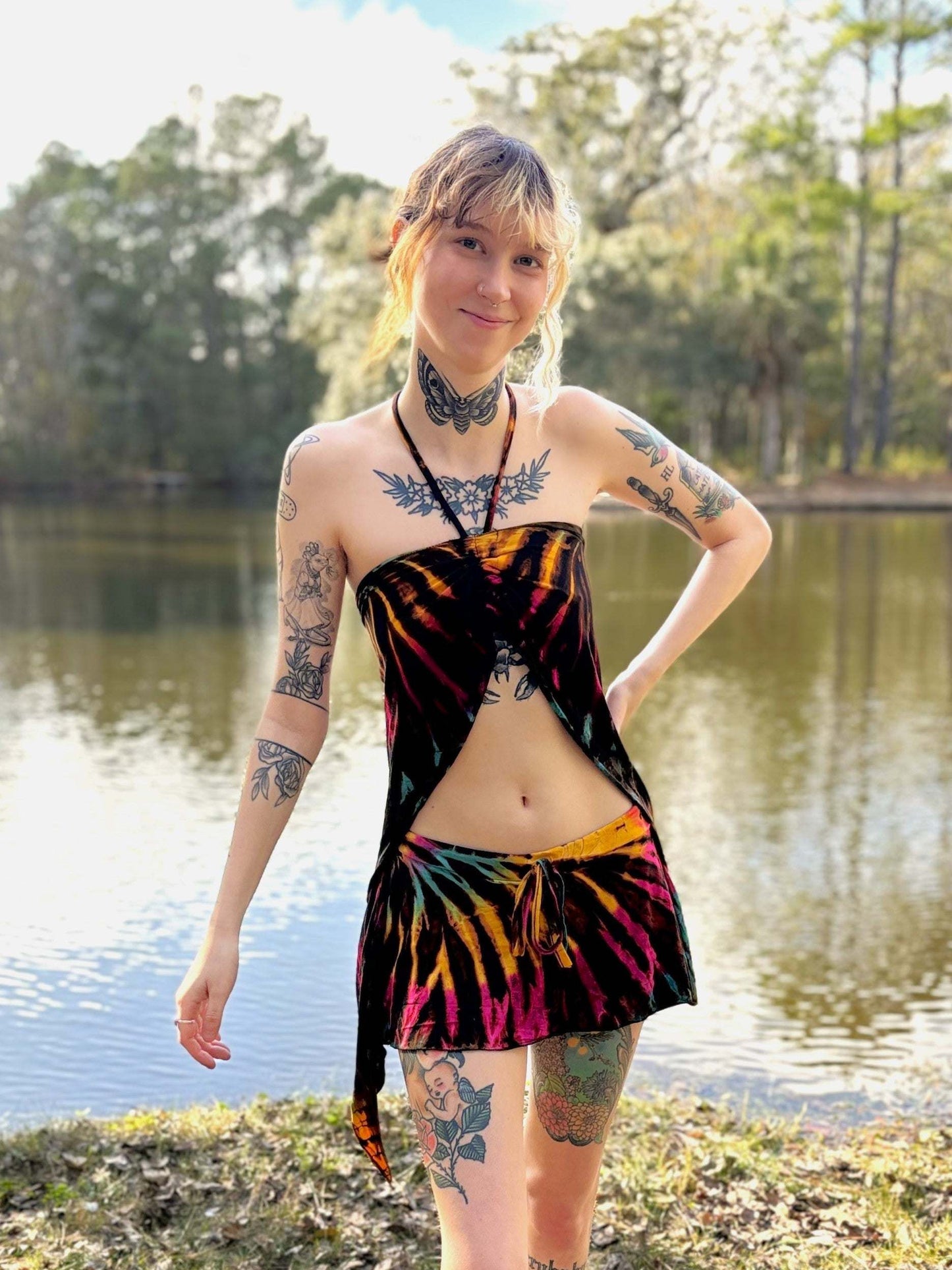 Skye top in vibrant colors by a lake, made from ethically sourced rayon and elastic.