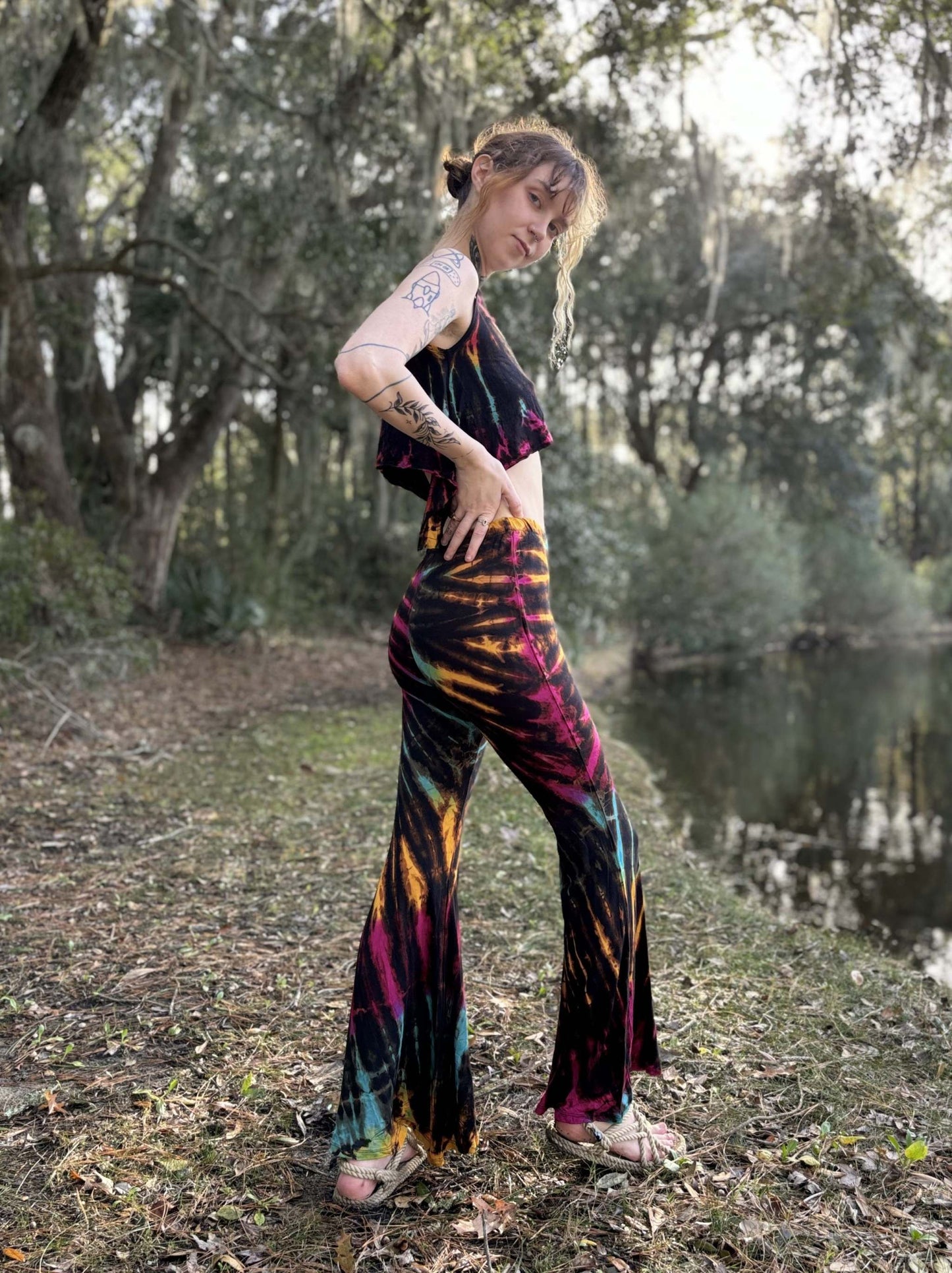 Tie-dye bell bottom pants made from 95% rayon and 5% elastic, hand-dyed in Thailand.