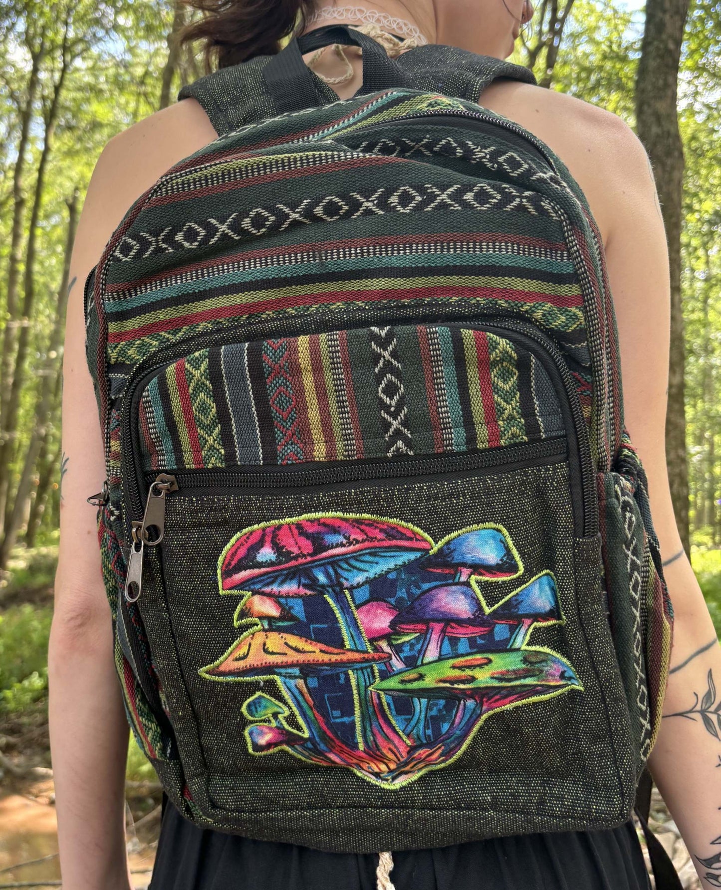 Hemp Mushroom Backpack with adjustable straps, handmade in Nepal, featuring colorful mushroom design and fits up to 15" laptop.
