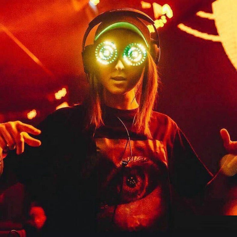 Luminous Rezonator goggles worn in a vibrant party setting.