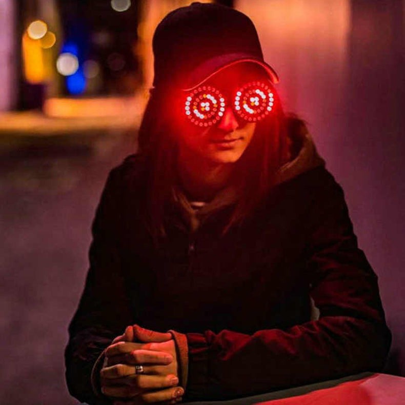 Luminous Rezonator goggles glowing in the dark with USB charging capability.