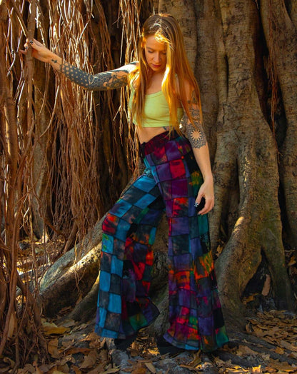 Handcrafted palazzo pants with vibrant dark patterns, made from fairtrade materials.