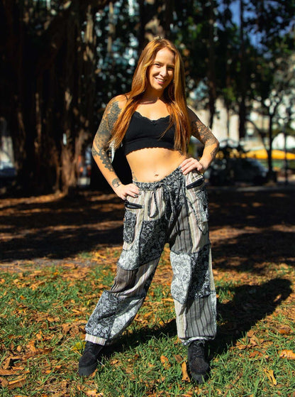 Flora Pants with mushroom pattern, elastic waist, zippered pocket, and patchwork design.
