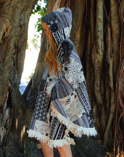 Handcrafted cotton poncho with coconut shell buttons, unique design.