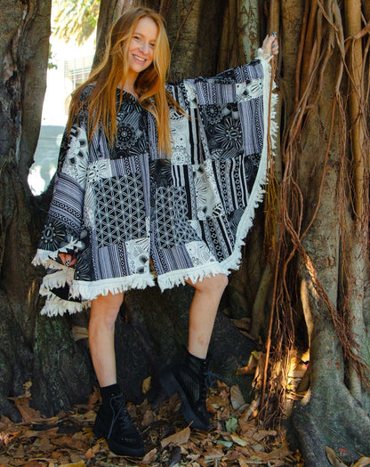 Cotton poncho with coconut shell buttons and hand-crafted printing pattern.