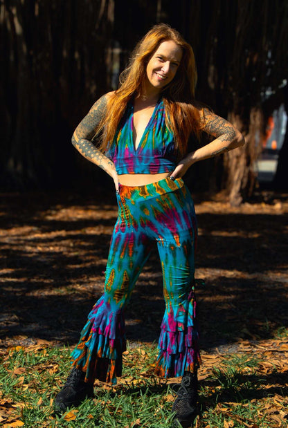 Colorful ruffle bottom pants with unique dye patterns, handcrafted from rayon and elastic.