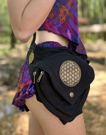 Black Seed of Life Belt Bag with metal clasps worn at a festival.