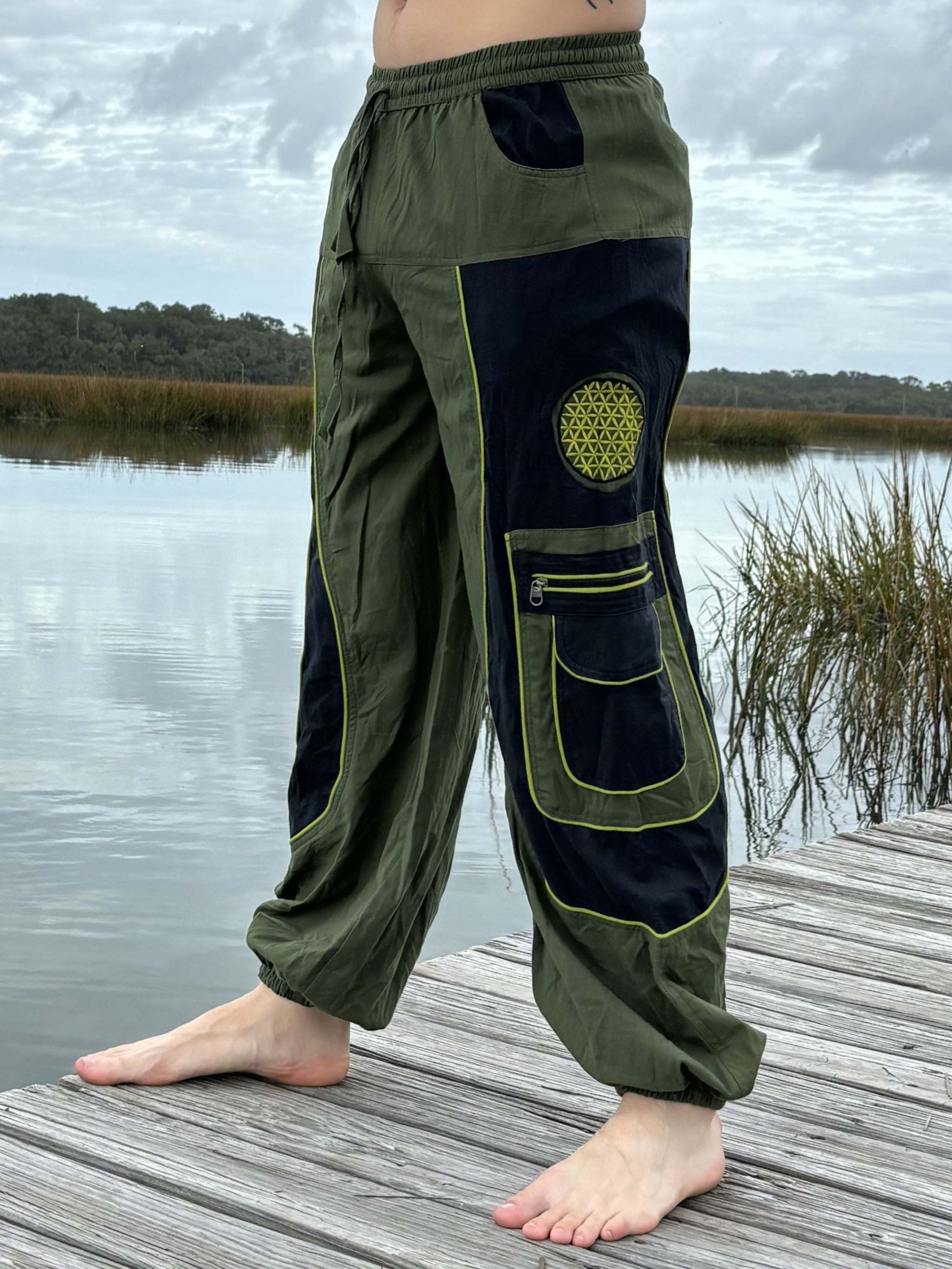 9 Pocket Harem Pants with elastic cuffs and waist, featuring three zipper pockets for security.