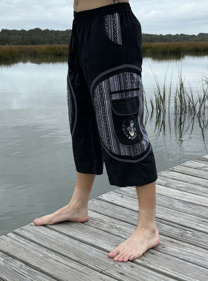 3/4 Mushroom shorts in IKAT design, 100% cotton, Fairtrade manufactured in Nepal, modeled outdoors.