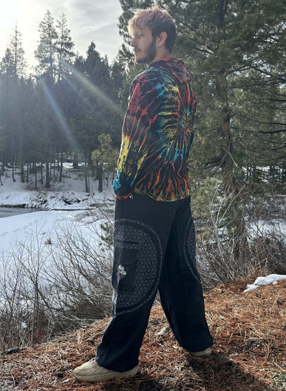 Mushroom Harem Pants with embroidery, worn by a person in a natural outdoor setting with snow and trees.