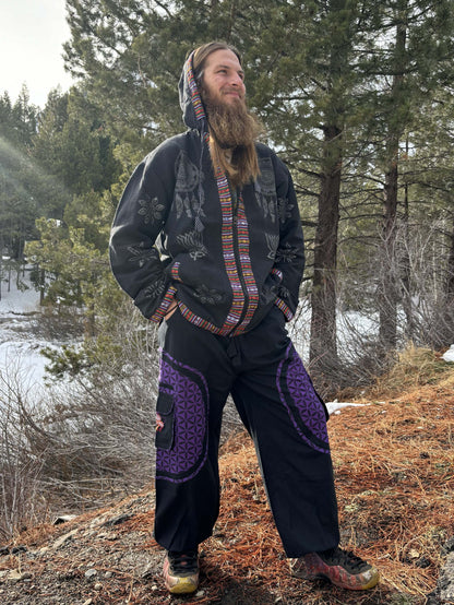 Hippie style pants with mushroom embroidery, made from natural handwoven cotton, featuring adjustable waist and multiple pockets, suitable for various occasions.