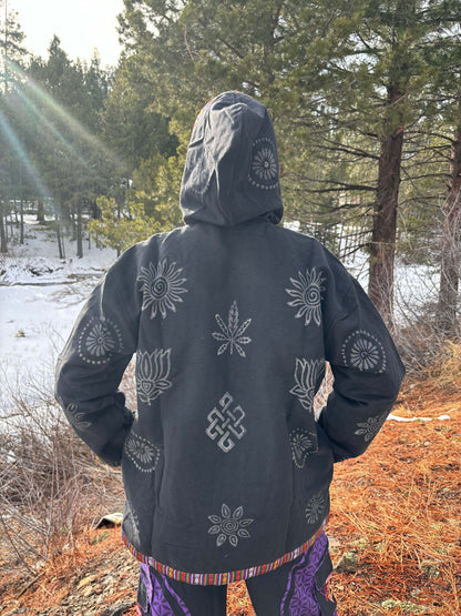 Handprinted cotton jacket with unique designs, handmade in Nepal, outdoor scene.