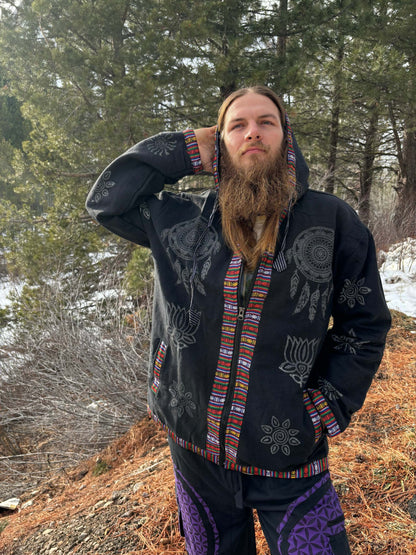 Handprinted cotton jacket worn outdoors in a forest setting.