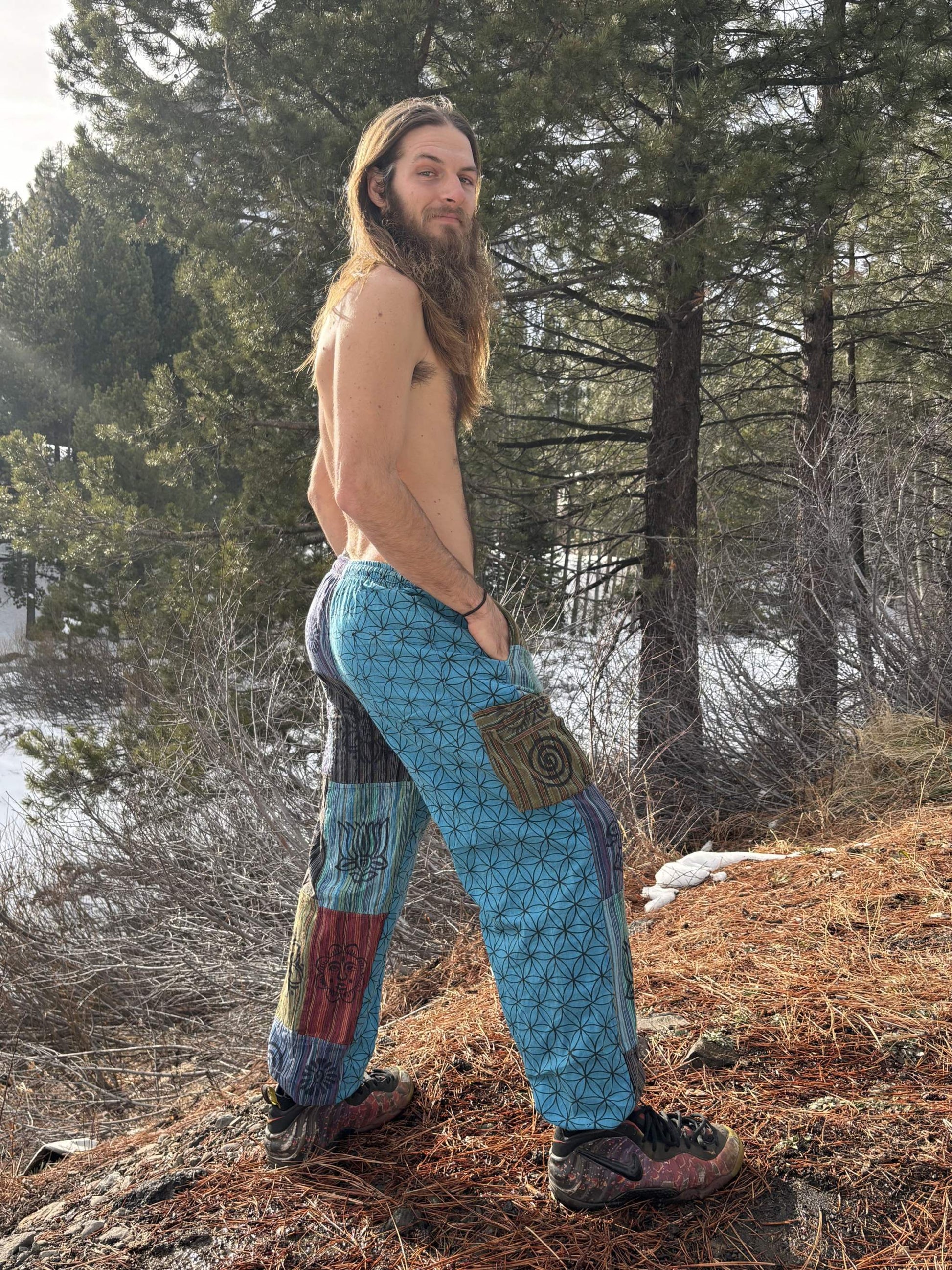 Life patchwork harem pants in nature setting, handmade in Nepal, colorful design.