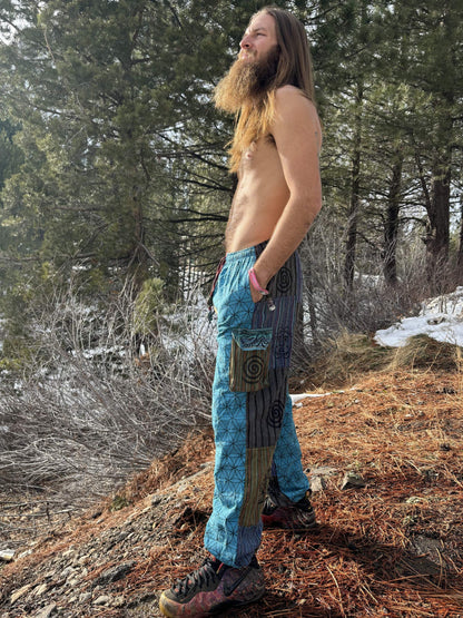 Man wearing Seed of Life patchwork harem pants in nature.