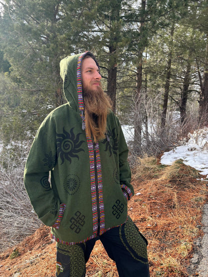 Handprinted cotton jacket from Nepal in green with unique patterns, worn outdoors.