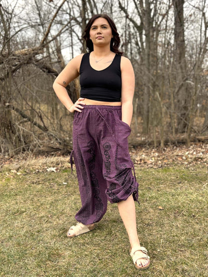 Cinch Leg Harem Pants featuring elastic waist and ankle cuffs, handmade from 100% cotton in Thailand, shown outdoors.