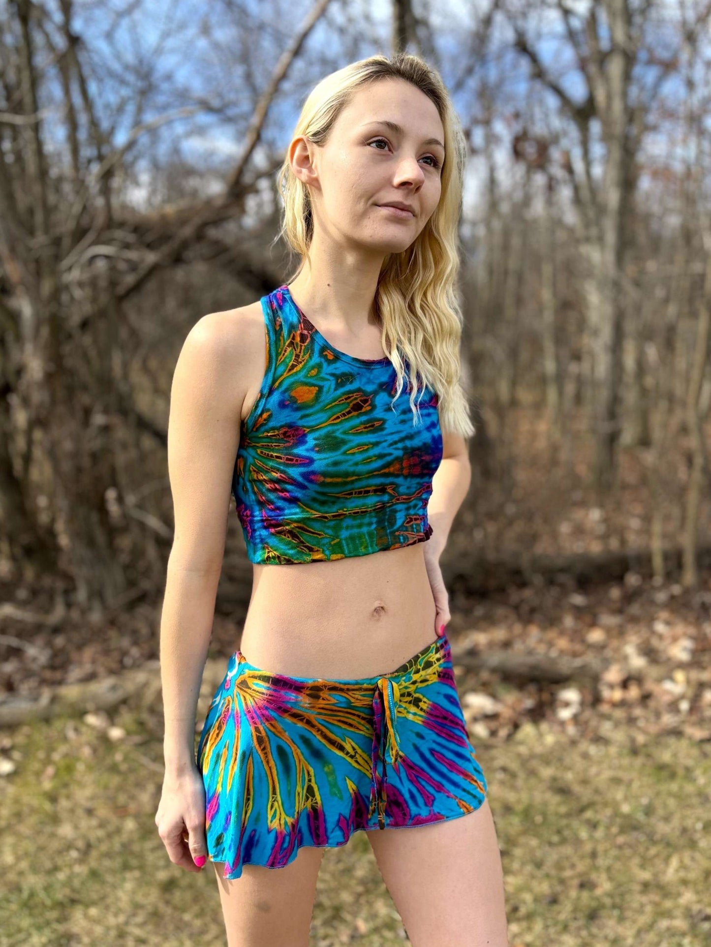 Mia sports bra in colorful, unique design worn by a person outdoors.