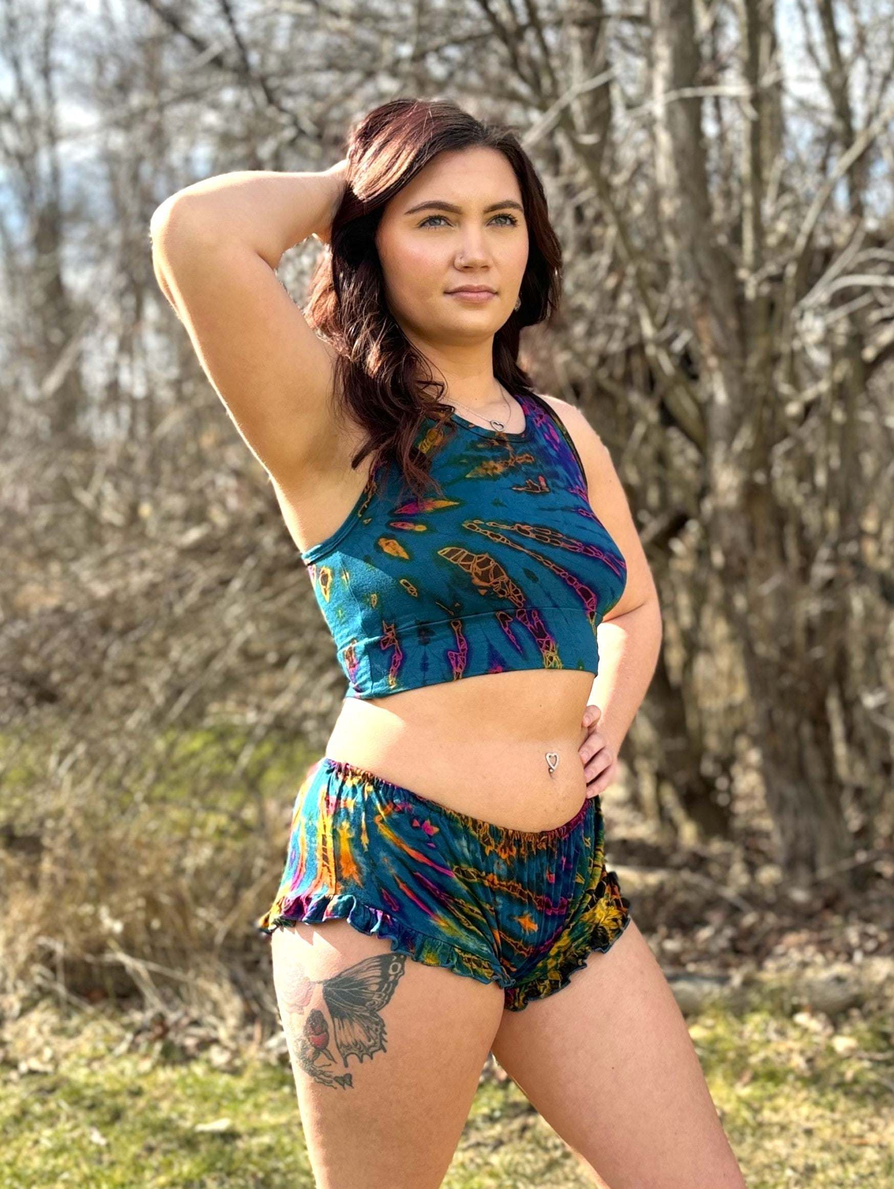 Mia sports bra in vibrant, unique color scheme, worn outdoors.