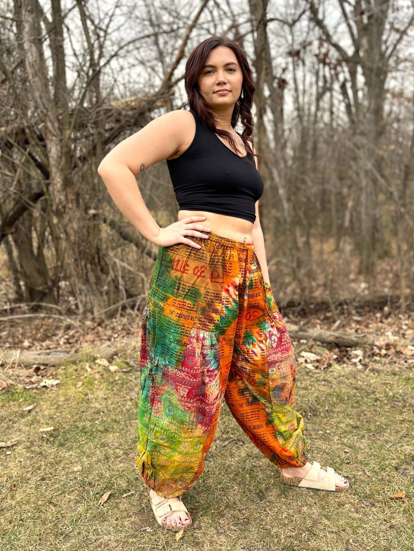 Wide leg Thai Dye Harem pants with colorful tie-dye pattern, elastic waistband, and ankle cuffs.