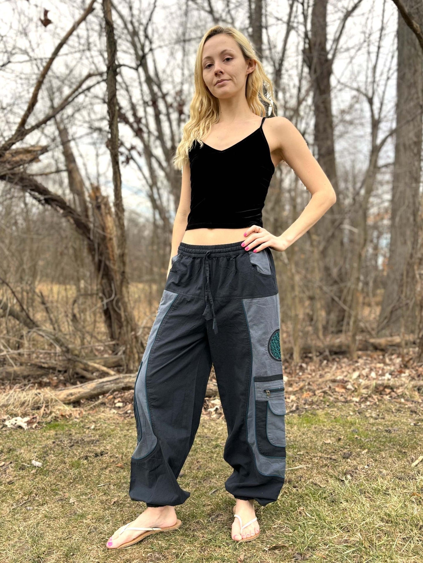 9 pocket harem pants with elastic cuffs and multiple zipper pockets.