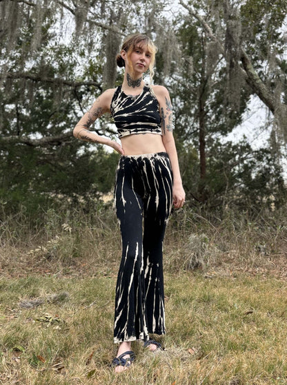 Tie-dye bell bottoms with a fitted style in black and white hues, hand-dyed in Thailand.