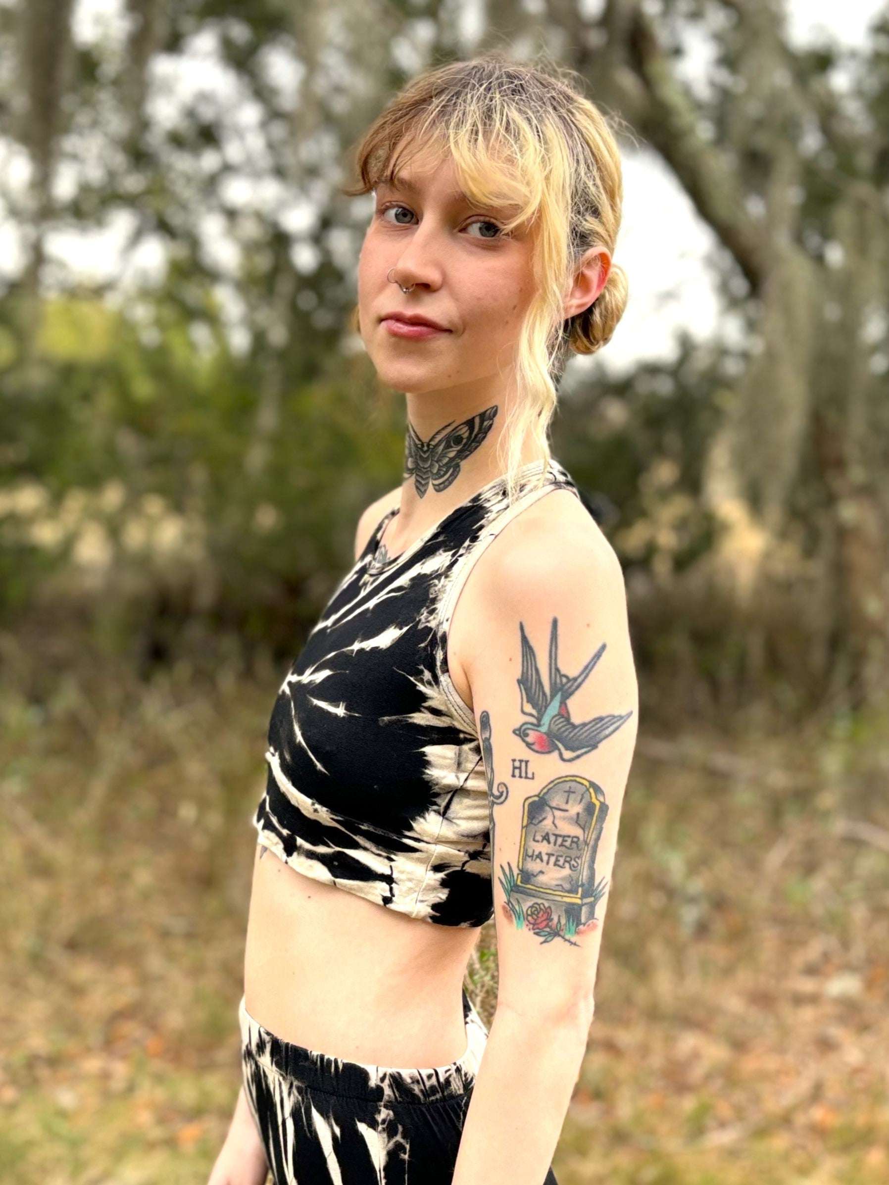 Mia sports bra with unique dye pattern and tattooed model.