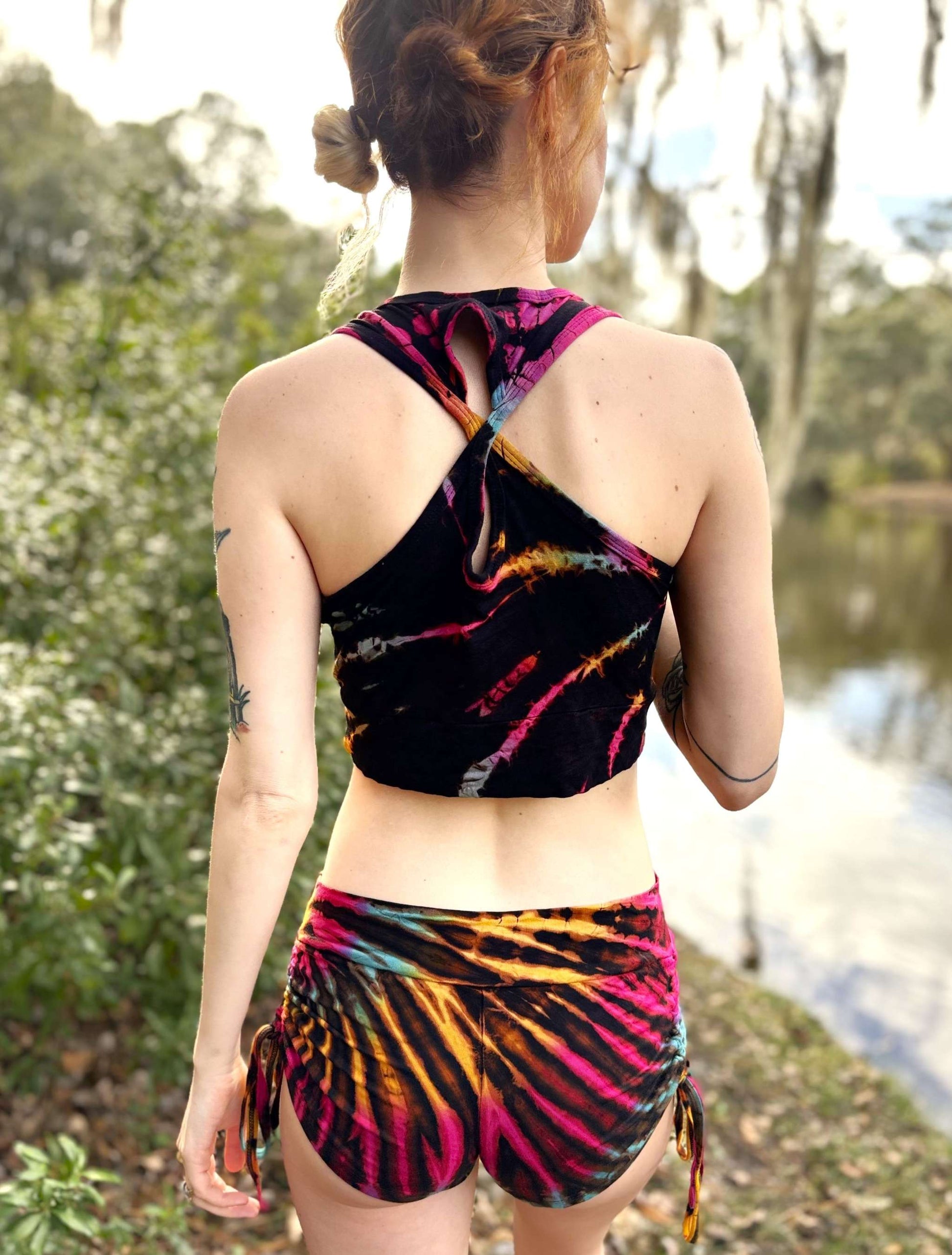 Mia colorful sports bra with unique dye pattern worn outdoors.