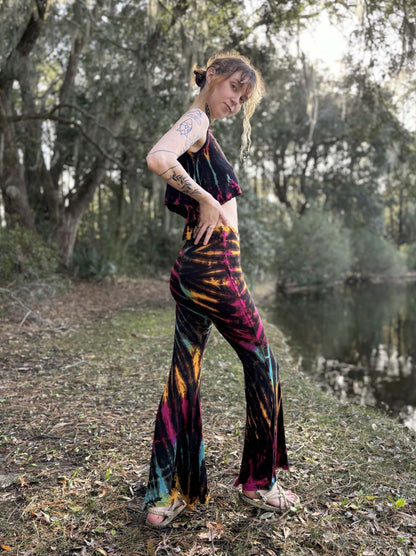 Tie-dye bell bottom pants made from 95% rayon and 5% elastic, hand-dyed in Thailand.