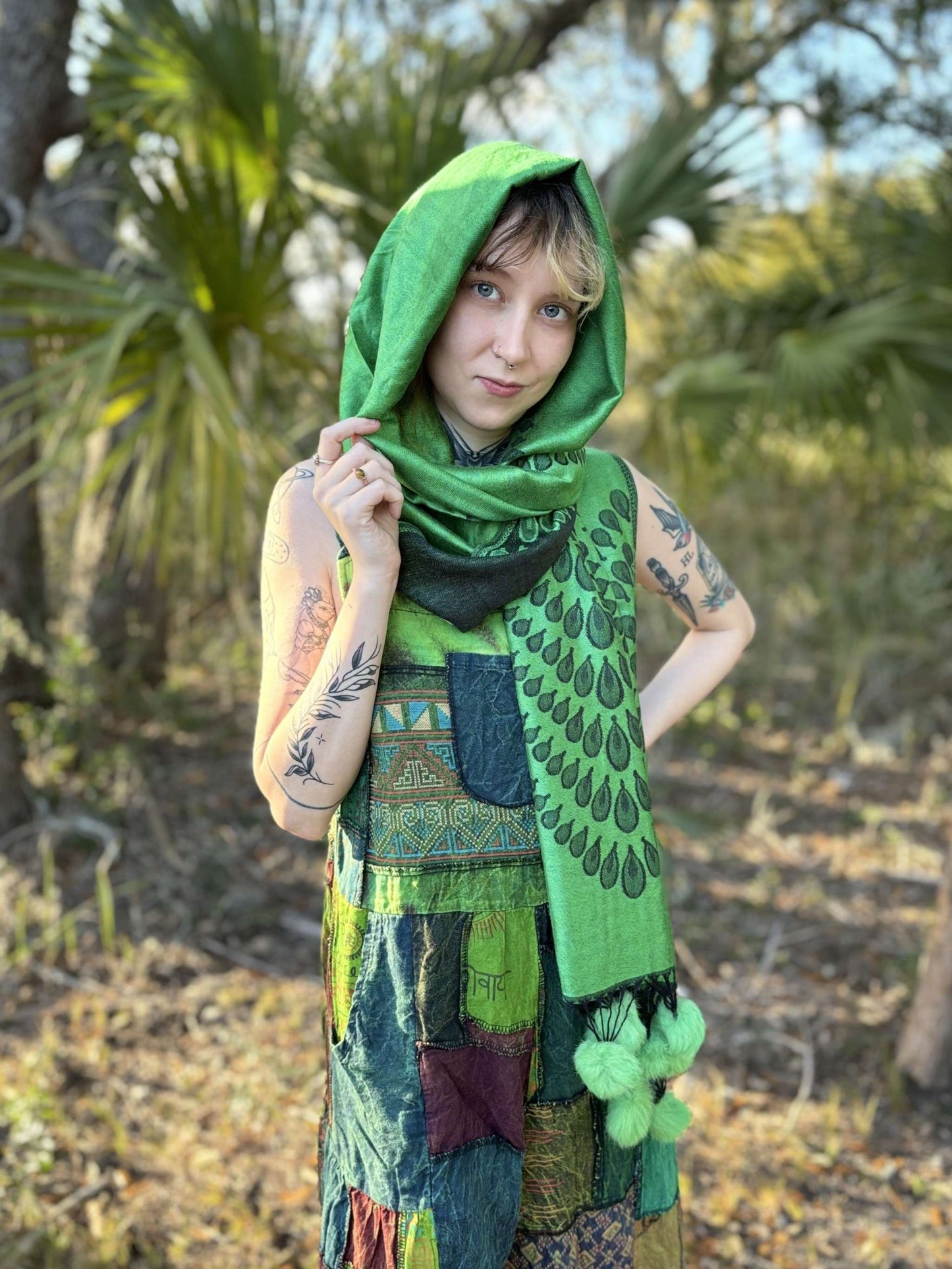 Green Pom-Pom Pashmina scarf in outdoor setting.