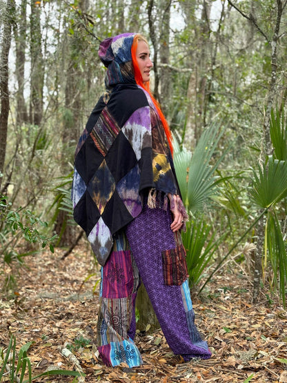 Tye-Dye Patchwork Poncho with wooden toggle buttons, handmade in Nepal, showcased in a forest setting.
