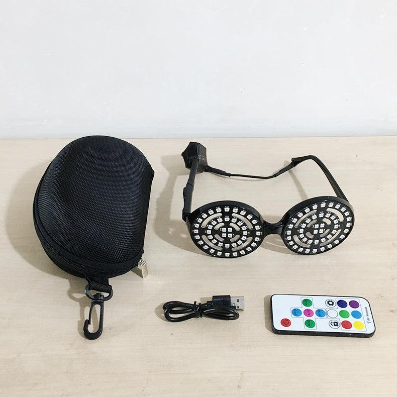 Rezonator goggles package with luminous glasses, USB charging cable, and remote control.